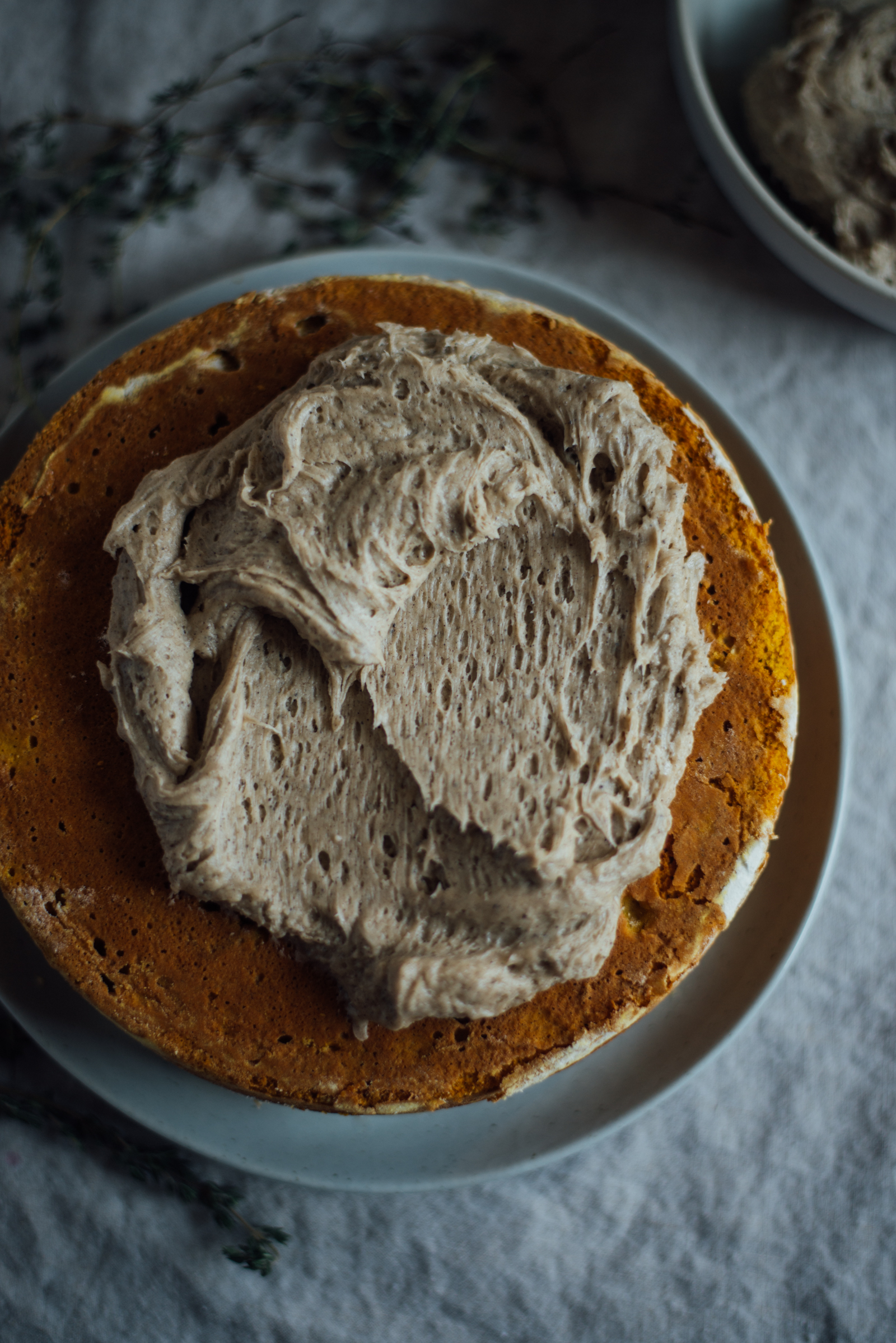 maple browned butter frosting slathered on chai pumpkin cake