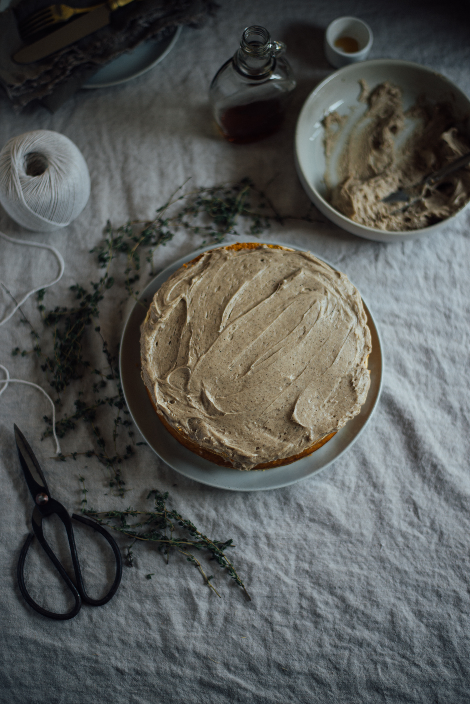 browned butter frosting slathered on chai pumpkin cake