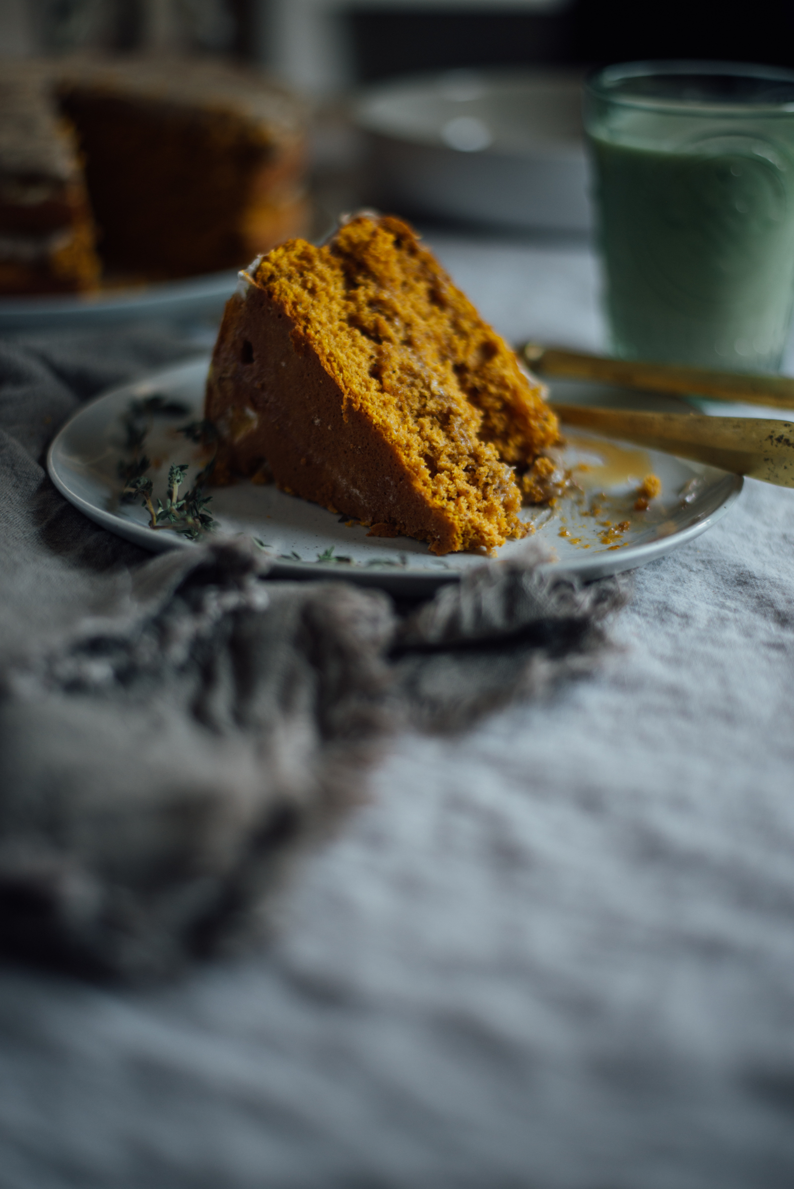 slice of chai pumpkin cake with maple browned butter frosting
