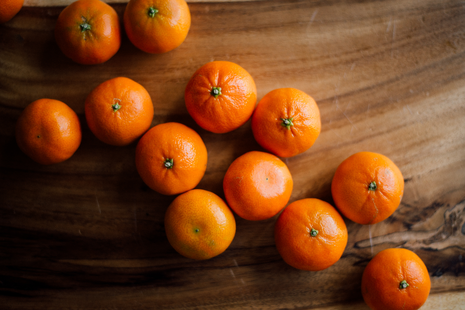 tangerines on wooden platter