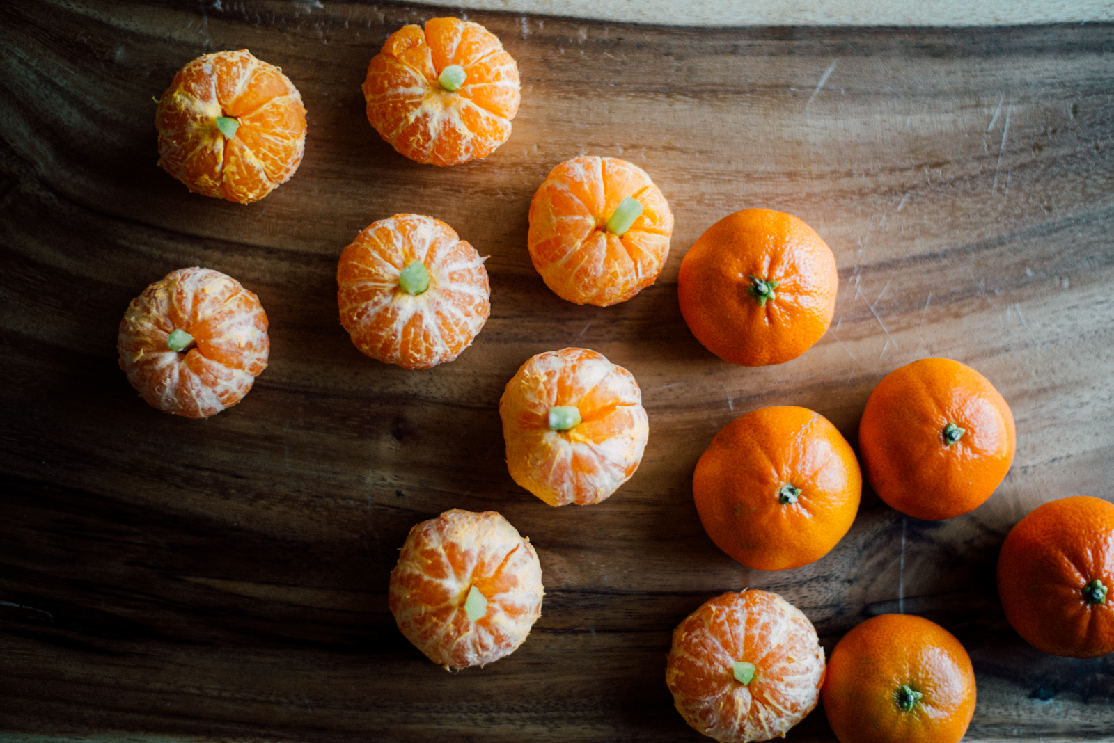 tangerines with celery sticks turned into edible pumpkins