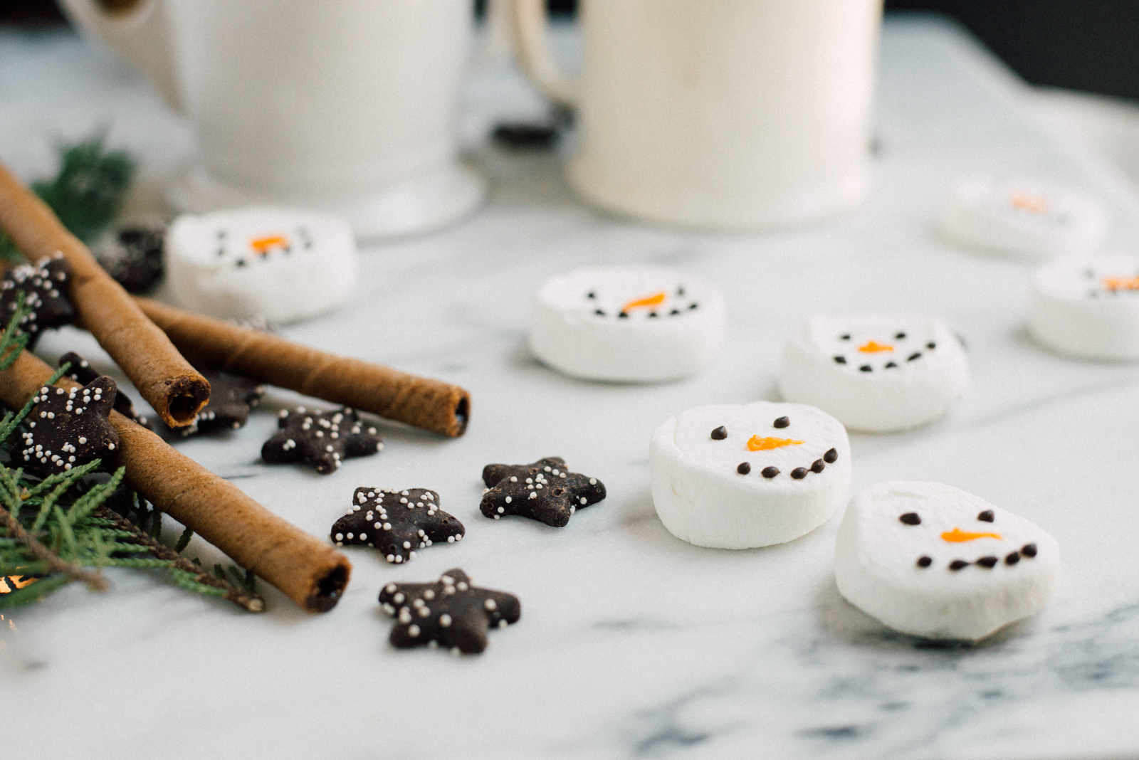 hot chocolate marshmallow snowmen on marble