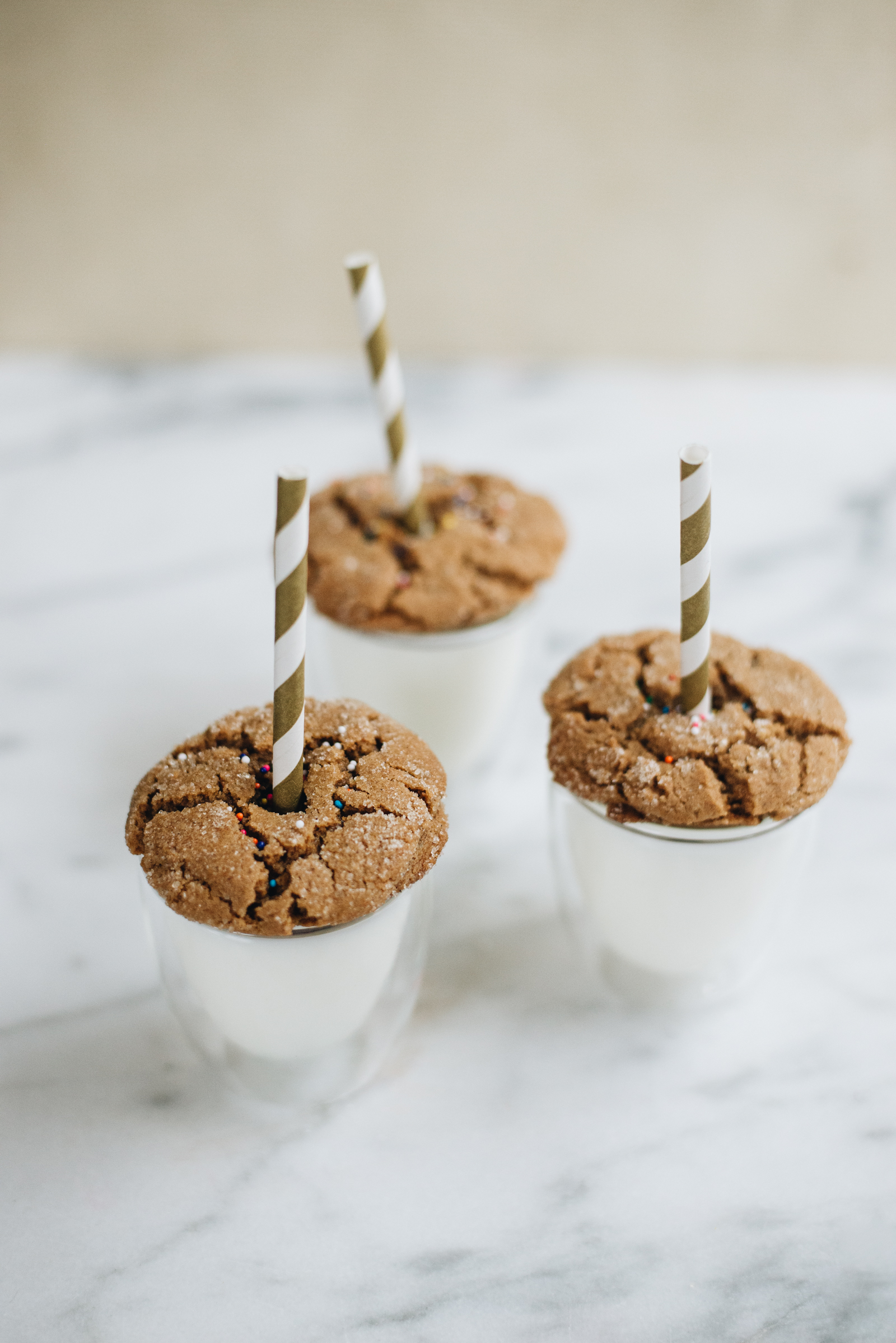 gingersnap cookie shooters in espresso cups with gold straws