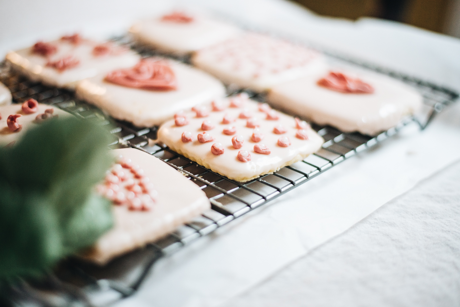 dipped sugar cookies in glaze on cooling rack valentine's day embroidery kids cookies casey wiegand