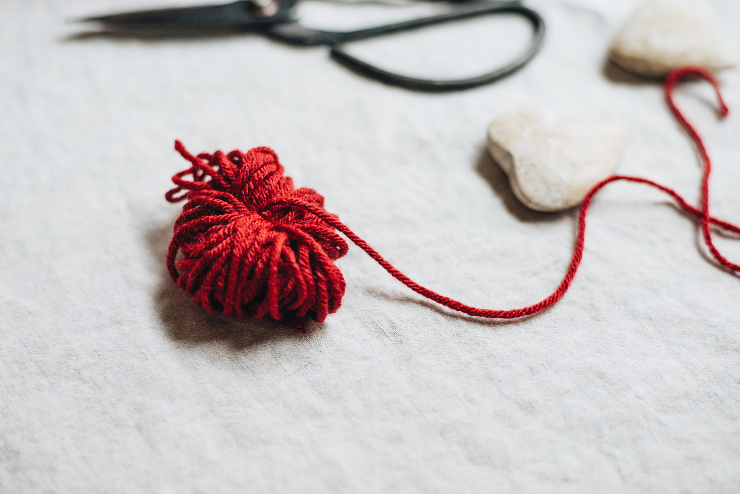 tie loop of yarn and snip with scissors