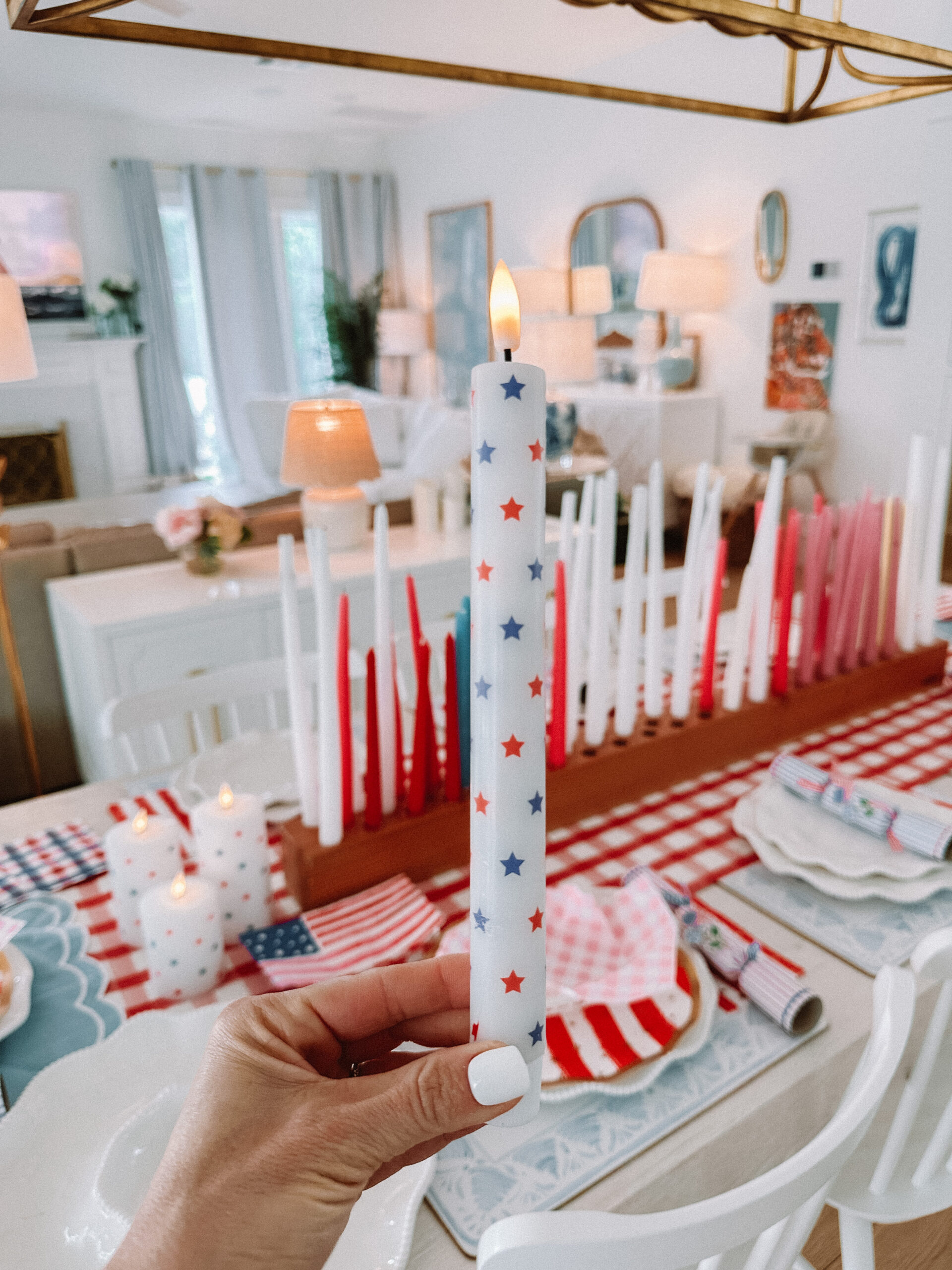 4th of july hosting 4th of july candles 4th of July Table Setting Red Gingham Table Runner Flag Plates Scalloped Plates Wood Candle Holder Star Candles Set Stanley Cup in Pool Patriotic Dinner Table Family 4th of July Celebration 4th of July Backyard Party